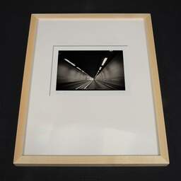 Photographie d'art et collection Denis Olivier, Moving In A Tunnel, Highway A83, France. Août 2020. Ref-1391 - Denis Olivier Photographie d'Art, cadre bois clair sur fond sombre