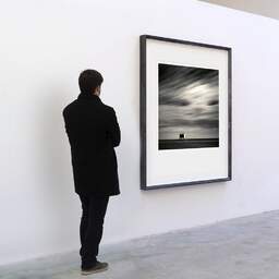 Art and collection photography Denis Olivier, Aid Station, Etude 1, Gruissan, France. October 2007. Ref-1133 - Denis Olivier Art Photography, A visitor contemplate a large original photographic art print in limited edition and signed in a black frame