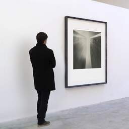 Art and collection photography Denis Olivier, Aqua Dojima NBF Tower, Etude 3, Osaka, Japan. July 2014. Ref-1296 - Denis Olivier Art Photography, A visitor contemplate a large original photographic art print in limited edition and signed in a black frame
