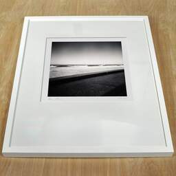 Art and collection photography Denis Olivier, Atlantic Coast, Ondres, France. March 2021. Ref-1417 - Denis Olivier Photography, white frame on a wooden table