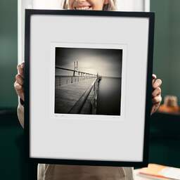 Art and collection photography Denis Olivier, Bench, Etude 5, Vasco Da Gama Bridge, Lisbon, Portugal. May 2007. Ref-1098 - Denis Olivier Photography, original 9 x 9 inches fine-art photograph print in limited edition and signed hold by a galerist woman