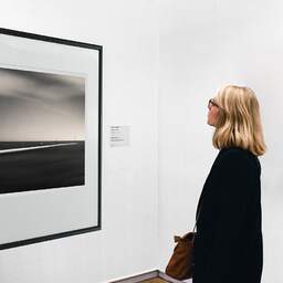 Art and collection photography Denis Olivier, Beyond The Horizon, Brittany, France. August 2005. Ref-1127 - Denis Olivier Art Photography, A woman contemplate a large original photographic art print in limited edition and signed in a black frame