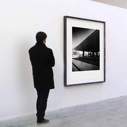 Art and collection photography Denis Olivier, Boca Market, Paludate, Bordeaux, France. September 2020. Ref-1388 - Denis Olivier Art Photography, A visitor contemplate a large original photographic art print in limited edition and signed in a black frame