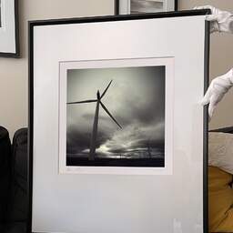 Art and collection photography Denis Olivier, Causeymire Wind Farm, Achkeepster Hill, Scotland. April 2006. Ref-970 - Denis Olivier Photography, large original 9 x 9 inches fine-art photograph print in limited edition and signed hold by a galerist woman
