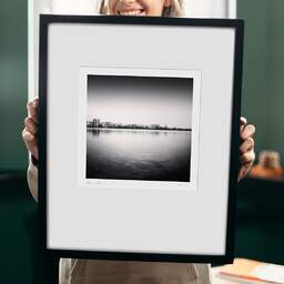 Art and collection photography Denis Olivier, City Skyline, Bordeaux-Lake, France. April 2021. Ref-11471 - Denis Olivier Art Photography, original 9 x 9 inches fine-art photograph print in limited edition and signed hold by a galerist woman