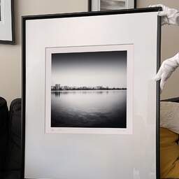 Art and collection photography Denis Olivier, City Skyline, Bordeaux-Lake, France. April 2021. Ref-11471 - Denis Olivier Art Photography, large original 9 x 9 inches fine-art photograph print in limited edition and signed hold by a galerist woman