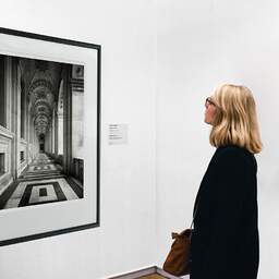 Art and collection photography Denis Olivier, Colbert Alley, Palais Du Louvre, Paris, France. April 2023. Ref-11682 - Denis Olivier Art Photography, A woman contemplate a large original photographic art print in limited edition and signed in a black frame