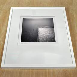 Art and collection photography Denis Olivier, Diving Boat Ramp, Hourtin Lake, France. May 2021. Ref-11457 - Denis Olivier Photography, white frame on a wooden table