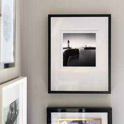 Art and collection photography Denis Olivier, East And West Jetty Lighthouses, Saint-Nazaire, France. August 2020. Ref-1425 - Denis Olivier Photography, original fine-art photograph signed in limited edition in a black wooden frame with other images hung on the wall
