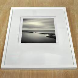 Art and collection photography Denis Olivier, East Helmsdale Harbour, Scotland, Scotland. April 2006. Ref-957 - Denis Olivier Art Photography, white frame on a wooden table