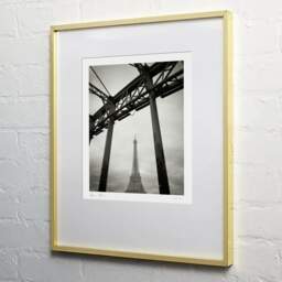 Art and collection photography Denis Olivier, Eiffel Tower, Debilly Footbridge, Paris, France. February 2022. Ref-11662 - Denis Olivier Photography, light wood frame on white wall