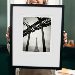 Art and collection photography Denis Olivier, Eiffel Tower, Debilly Footbridge, Paris, France. February 2022. Ref-11662 - Denis Olivier Photography, original 9 x 9 inches fine-art photograph print in limited edition and signed hold by a galerist woman