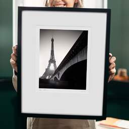 Art and collection photography Denis Olivier, Eiffel Tower Sunrise, Paris, France. February 2022. Ref-11625 - Denis Olivier Art Photography, original 9 x 9 inches fine-art photograph print in limited edition and signed hold by a galerist woman