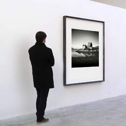 Art and collection photography Denis Olivier, Eilean Donan Castle, Etude 4, Highlands, Scotland. August 2022. Ref-11675 - Denis Olivier Art Photography, A visitor contemplate a large original photographic art print in limited edition and signed in a black frame
