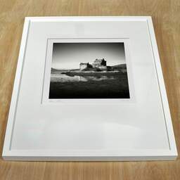 Art and collection photography Denis Olivier, Eilean Donan Castle, Etude 4, Highlands, Scotland. August 2022. Ref-11675 - Denis Olivier Art Photography, white frame on a wooden table