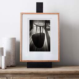Art and collection photography Denis Olivier, End Table In The Morning Sun, Hôtel Les Bains D'Arguin, Arcachon. June 2020. Ref-1349 - Denis Olivier Photography, gallery exhibition with black frame