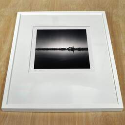 Art and collection photography Denis Olivier, Garonne Quays And St-Michael Basilica Tower, Bordeaux, France. September 2020. Ref-1366 - Denis Olivier Art Photography, white frame on a wooden table