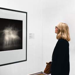 Art and collection photography Denis Olivier, Ghost Opera, Etude 16, The Swan Lake, Berlin. April 1998. Ref-866 - Denis Olivier Art Photography, A woman contemplate a large original photographic art print in limited edition and signed in a black frame