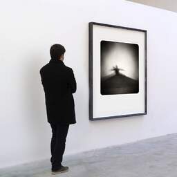 Art and collection photography Denis Olivier, Ghost Opera, Etude 29. December 2008. Ref-1206 - Denis Olivier Art Photography, A visitor contemplate a large original photographic art print in limited edition and signed in a black frame