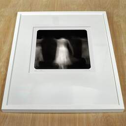 Art and collection photography Denis Olivier, Ghost Opera, Etude 30. January 2009. Ref-1207 - Denis Olivier Photography, white frame on a wooden table