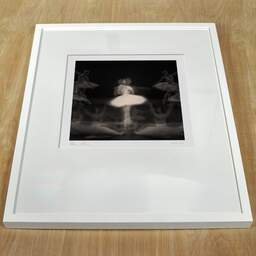 Art and collection photography Denis Olivier, Ghost Opera, Etude 32, The Swan Lake, Berlin, Germany. April 1998. Ref-11468 - Denis Olivier Photography, white frame on a wooden table