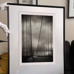 Art and collection photography Denis Olivier, Golden Gate Bridge, San Francisco Bay, California, USA. February 2013. Ref-1337 - Denis Olivier Photography, large original 9 x 9 inches fine-art photograph print in limited edition and signed hold by a galerist woman