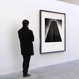 Art and collection photography Denis Olivier, Grain Silos, Bordeaux-Bassens Harbour, France. February 2006. Ref-906 - Denis Olivier Art Photography, A visitor contemplate a large original photographic art print in limited edition and signed in a black frame