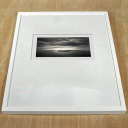 Art and collection photography Denis Olivier, Halfway To Daylight, Saintes-Maries-De-La-Mer, France. October 2007. Ref-1147 - Denis Olivier Photography, white frame on a wooden table