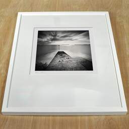 Art and collection photography Denis Olivier, Harbour Board, Dover Beach, England. April 2006. Ref-941 - Denis Olivier Photography, white frame on a wooden table