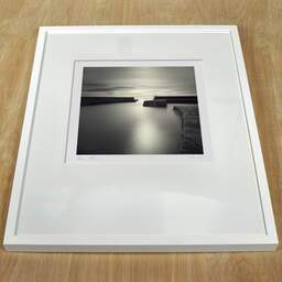 Art and collection photography Denis Olivier, Harbour Broch, Scotland, Scotland. April 2006. Ref-965 - Denis Olivier Art Photography, white frame on a wooden table