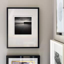 Art and collection photography Denis Olivier, Horizon And Pier Edge, Les Boucholeurs, France. December 2010. Ref-1258 - Denis Olivier Photography, original fine-art photograph signed in limited edition in a black wooden frame with other images hung on the wall