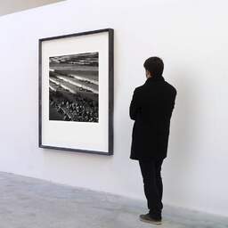 Art and collection photography Denis Olivier, Leaves On Steps, Palais De Tokyo, Paris, France. December 2003. Ref-493 - Denis Olivier Art Photography, A visitor contemplate a large original photographic art print in limited edition and signed in a black frame