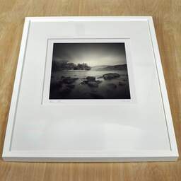 Art and collection photography Denis Olivier, Loch Earn, Wales, Wales. April 2006. Ref-951 - Denis Olivier Art Photography, white frame on a wooden table