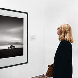 Art and collection photography Denis Olivier, Loch Linnhe, Etude 2, Glencoe, Scotland. August 2022. Ref-11615 - Denis Olivier Art Photography, A woman contemplate a large original photographic art print in limited edition and signed in a black frame