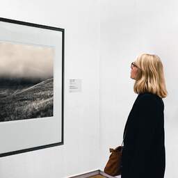 Art and collection photography Denis Olivier, Lost Somewhere, Pyrénées, France. August 1990. Ref-920 - Denis Olivier Art Photography, A woman contemplate a large original photographic art print in limited edition and signed in a black frame