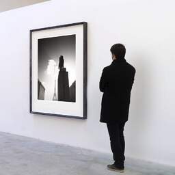 Art and collection photography Denis Olivier, Marshal Foch Statue, Trocadéro Place, Paris, France. February 2022. Ref-11687 - Denis Olivier Art Photography, A visitor contemplate a large original photographic art print in limited edition and signed in a black frame