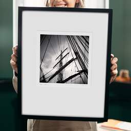 Art and collection photography Denis Olivier, Masts And Ropes, Etude 1, Belem Ship, France. June 2022. Ref-11551 - Denis Olivier Photography, original 9 x 9 inches fine-art photograph print in limited edition and signed hold by a galerist woman