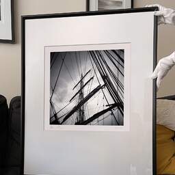 Art and collection photography Denis Olivier, Masts And Ropes, Etude 1, Belem Ship, France. June 2022. Ref-11551 - Denis Olivier Art Photography, large original 9 x 9 inches fine-art photograph print in limited edition and signed hold by a galerist woman