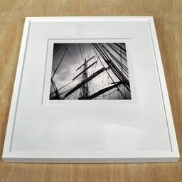 Art and collection photography Denis Olivier, Masts And Ropes, Etude 1, Belem Ship, France. June 2022. Ref-11551 - Denis Olivier Photography, white frame on a wooden table