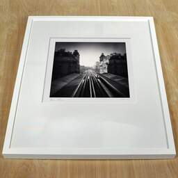 Art and collection photography Denis Olivier, Metro Line 6, Passy Station, Paris, France. February 2022. Ref-11526 - Denis Olivier Photography, white frame on a wooden table