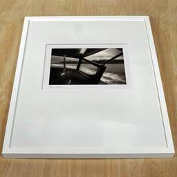 Art and collection photography Denis Olivier, Motoscafo, Venice, Italy. March 2017. Ref-11461 - Denis Olivier Photography, white frame on a wooden table