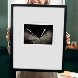 Art and collection photography Denis Olivier, Moving In A Tunnel, Highway A83, France. August 2020. Ref-1391 - Denis Olivier Photography, original 9 x 9 inches fine-art photograph print in limited edition and signed hold by a galerist woman