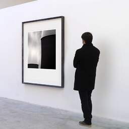 Art and collection photography Denis Olivier, Nuclear Power Plant, Etude 7, Golfech, France. August 2006. Ref-11541 - Denis Olivier Art Photography, A visitor contemplate a large original photographic art print in limited edition and signed in a black frame
