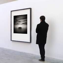 Art and collection photography Denis Olivier, Old Pier, Etude 1, Nice, France. October 2011. Ref-1263 - Denis Olivier Art Photography, A visitor contemplate a large original photographic art print in limited edition and signed in a black frame