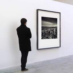 Art and collection photography Denis Olivier, Old Poles, Colwyn Bay, Wales. April 2006. Ref-948 - Denis Olivier Art Photography, A visitor contemplate a large original photographic art print in limited edition and signed in a black frame