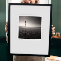Art and collection photography Denis Olivier, One Pole, Port Cassy Beach, France. September 2005. Ref-771 - Denis Olivier Photography, original 9 x 9 inches fine-art photograph print in limited edition and signed hold by a galerist woman