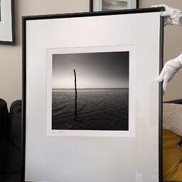 Art and collection photography Denis Olivier, One Pole, Port Cassy Beach, France. September 2005. Ref-771 - Denis Olivier Photography, large original 9 x 9 inches fine-art photograph print in limited edition and signed hold by a galerist woman