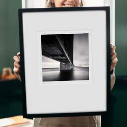 Art and collection photography Denis Olivier, Øresund Bridge, Etude 2, Malmö, Sweden. October 2008. Ref-11512 - Denis Olivier Photography, original 9 x 9 inches fine-art photograph print in limited edition and signed hold by a galerist woman