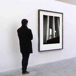 Art and collection photography Denis Olivier, Palais De Tokyo, Paris, France. February 2023. Ref-11672 - Denis Olivier Art Photography, A visitor contemplate a large original photographic art print in limited edition and signed in a black frame