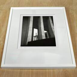 Art and collection photography Denis Olivier, Palais De Tokyo, Paris, France. February 2023. Ref-11672 - Denis Olivier Art Photography, white frame on a wooden table